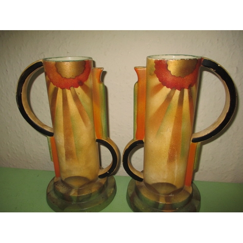 257 - A Clarice Cliff Patina tree biscuit barrel and 2 other art deco vases, retaining original raffia han... 