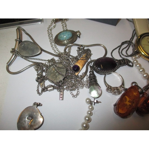 157 - A parcel of vintage costume jewellery, to include silver and amber items, all in used condition