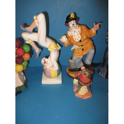 276 - A parcel of vintage Royal Doulton figures, to include a Jester HN2016 A wizard HN 2877 and a Clown H... 