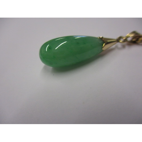 82 - An Indian gold necklace chain with jade teardrop pendant, marked 22c, approx. linear length of chain... 