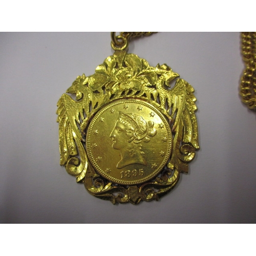 83 - An Indian gold necklace chain and pendant, the pendant having an 1895 American gold 10 dollar coin, ... 