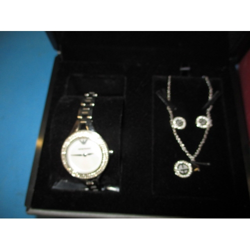 127 - A boxed Emporio Armani watch gift set, with matching earrings and necklace, in original box, working... 