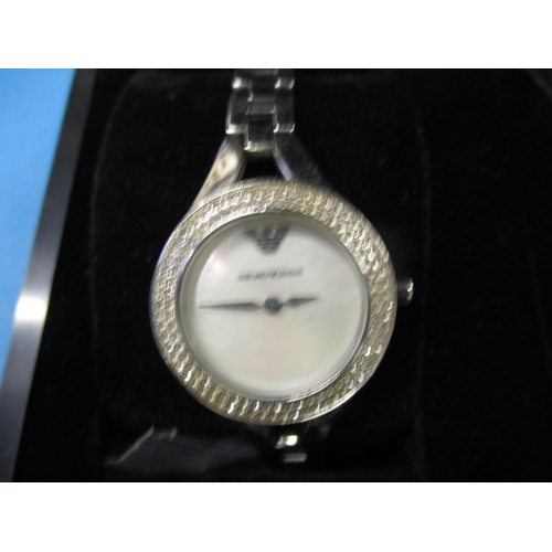 127 - A boxed Emporio Armani watch gift set, with matching earrings and necklace, in original box, working... 