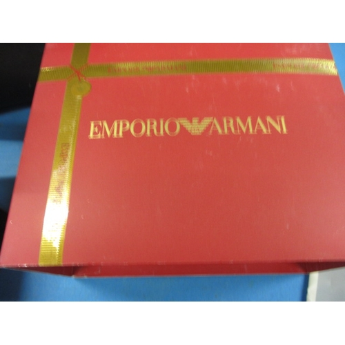 127 - A boxed Emporio Armani watch gift set, with matching earrings and necklace, in original box, working... 