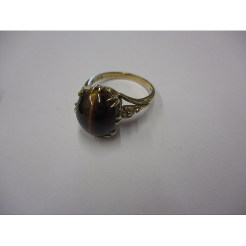 16 - A vintage 9ct gold ring with cabochon tigers eye stone, approx. ring size ‘N’, approx. weight 4.2g i... 