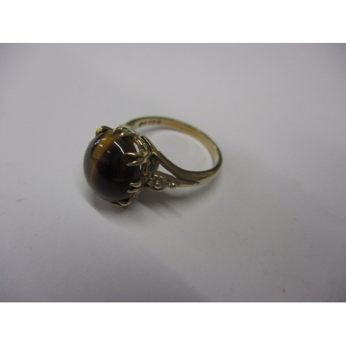 16 - A vintage 9ct gold ring with cabochon tigers eye stone, approx. ring size ‘N’, approx. weight 4.2g i... 