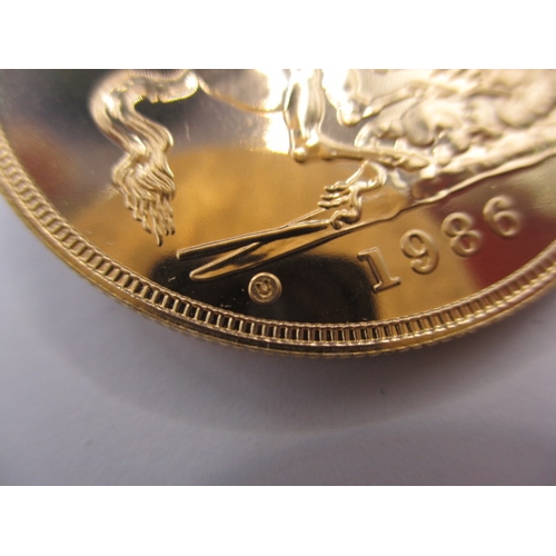 178 - A 1986 gold £5 coin, in brilliantly uncirculated condition, housed in plastic capsule, approx. weigh... 