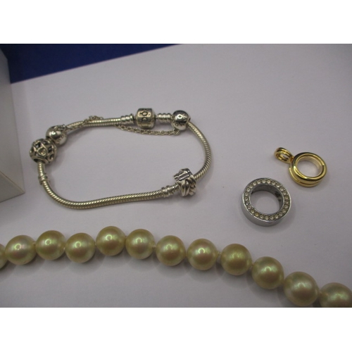 164 - A genuine Pandora bracelet and a Christian Dior necklace, both in good pre-owned condition