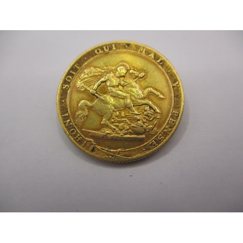 180 - A George III gold sovereign dated 1820, a circulated coin with fine definition of features