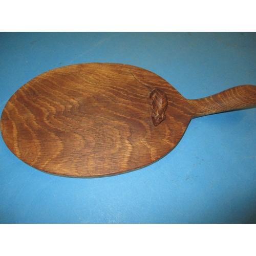 259 - A vintage Robert Thompson (Mouseman) cheese board, having a well carved mouse, general use related m... 