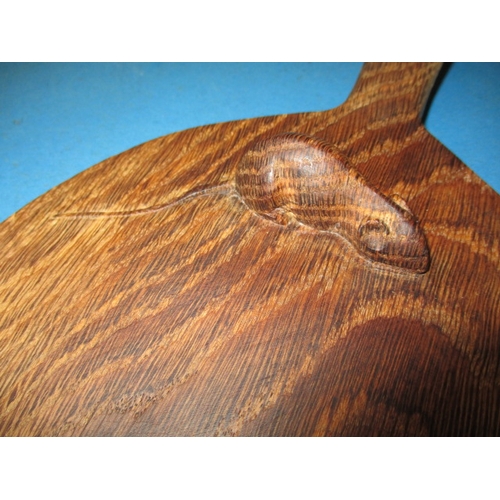 259 - A vintage Robert Thompson (Mouseman) cheese board, having a well carved mouse, general use related m... 