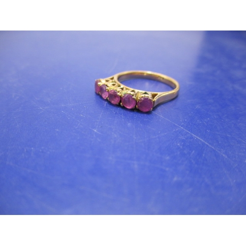 18 - A 5 stone ruby, yellow gold dress ring. Approximate ring size M ½ , approx. weight 3.9g