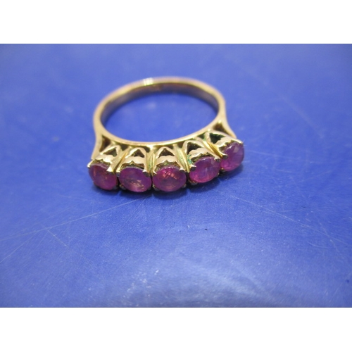 18 - A 5 stone ruby, yellow gold dress ring. Approximate ring size M ½ , approx. weight 3.9g