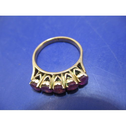 18 - A 5 stone ruby, yellow gold dress ring. Approximate ring size M ½ , approx. weight 3.9g