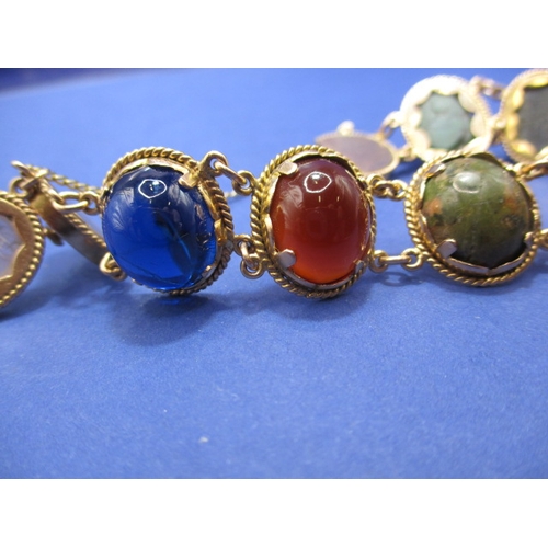 93 - A high carat Egyptian gold bracelet set with semi-precious stones, with working clasp and safety cha... 