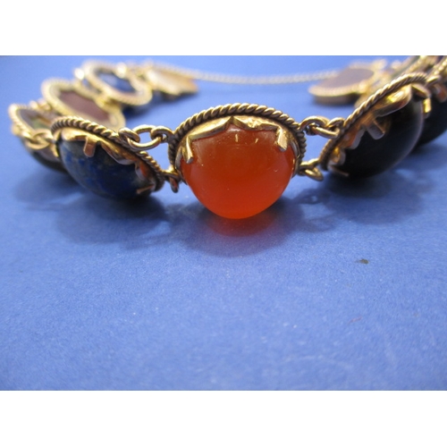 93 - A high carat Egyptian gold bracelet set with semi-precious stones, with working clasp and safety cha... 