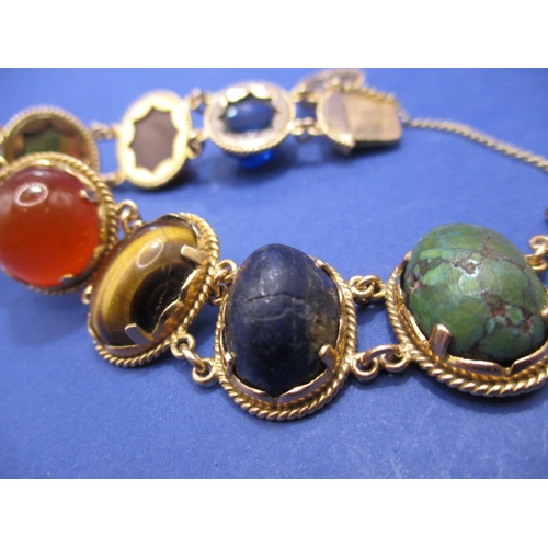 93 - A high carat Egyptian gold bracelet set with semi-precious stones, with working clasp and safety cha... 