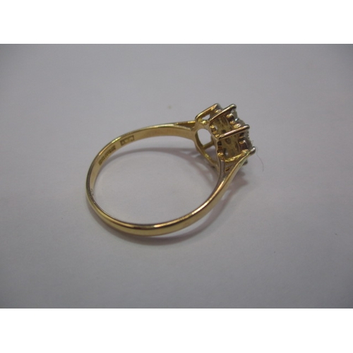 23 - An 18ct gold diamond daisy ring. Approx. ring size L, approx. weight 2.1g