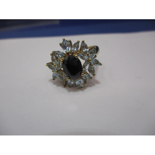 24 - A 9ct gold dress ring set with aquamarine and a central sapphire. Approx. ring size Q. Approx. weigh... 