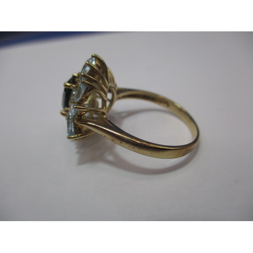 24 - A 9ct gold dress ring set with aquamarine and a central sapphire. Approx. ring size Q. Approx. weigh... 