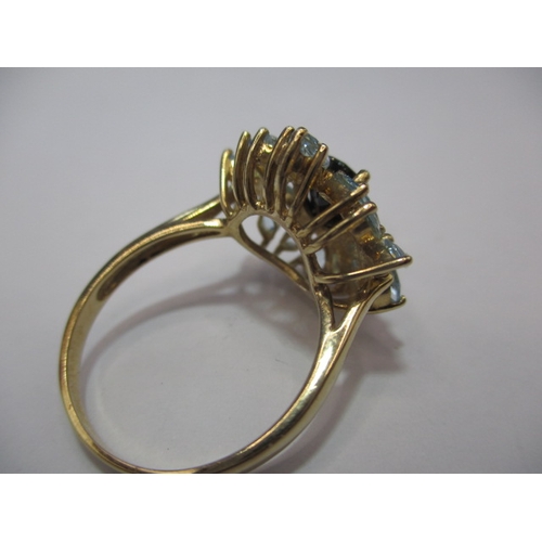 24 - A 9ct gold dress ring set with aquamarine and a central sapphire. Approx. ring size Q. Approx. weigh... 