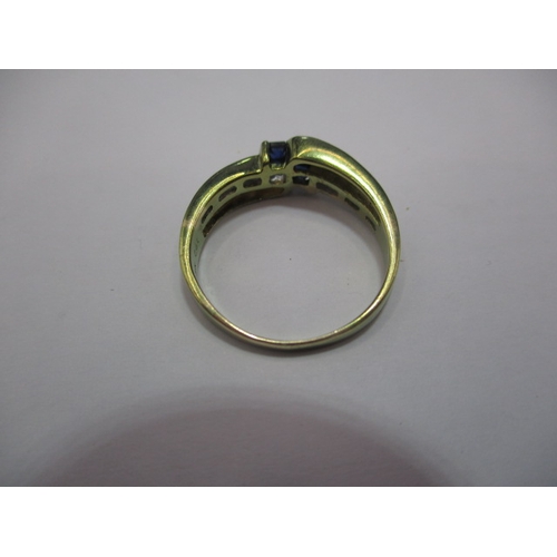 26 - A 14ct gold diamond and sapphire stylised ring. Approx. ring size L, approx. weight 2.5g