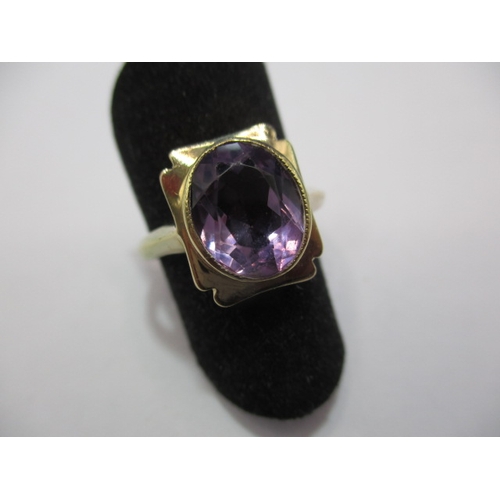 27 - A 9ct gold art deco style ring set with oval amethyst. Approx. ring size N, approx. weight 3.2g