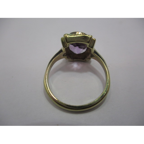 27 - A 9ct gold art deco style ring set with oval amethyst. Approx. ring size N, approx. weight 3.2g