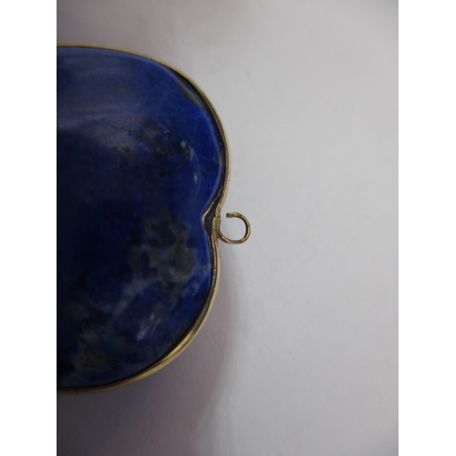 120 - An antique lapis lazuli heart shaped pendant, with yellow metal mount, worn top eye.