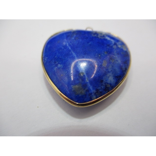 120 - An antique lapis lazuli heart shaped pendant, with yellow metal mount, worn top eye.