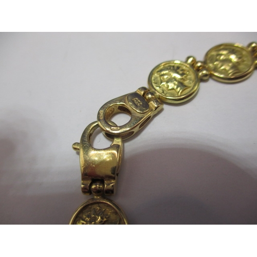 95 - A 750 yellow gold bracelet, having a broken link joint, approx. weight 22.5g