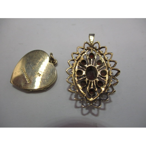 100 - Two necklace pendants, one 9ct gold the other yellow metal set with garnets, both in useable pre-own... 