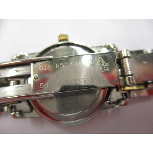 129 - A ladies Omega 1456 wrist watch, having diamond set bezel, in working order with box and all paperwo... 