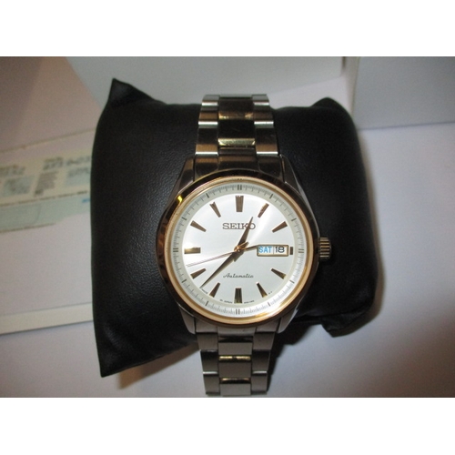 130 - A pre-owned gents Seiko automatic day date wrist watch, in good working order with box and paperwork... 