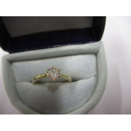 1 - A 585 yellow gold diamond solitaire ring, near new, the stone: round brilliant 0.44ct H VVS2, approx... 