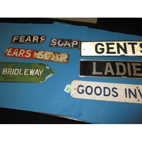 302 - A parcel of vintage information signs and enamel advertising signs, some damages and use-related mar... 