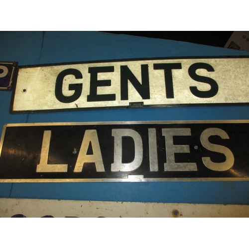 302 - A parcel of vintage information signs and enamel advertising signs, some damages and use-related mar... 