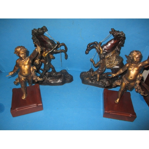 279 - A pair of cast metal Marley horses and a pair of cherubs, in useable pre-owned condition with age-re... 