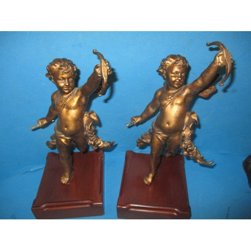 279 - A pair of cast metal Marley horses and a pair of cherubs, in useable pre-owned condition with age-re... 