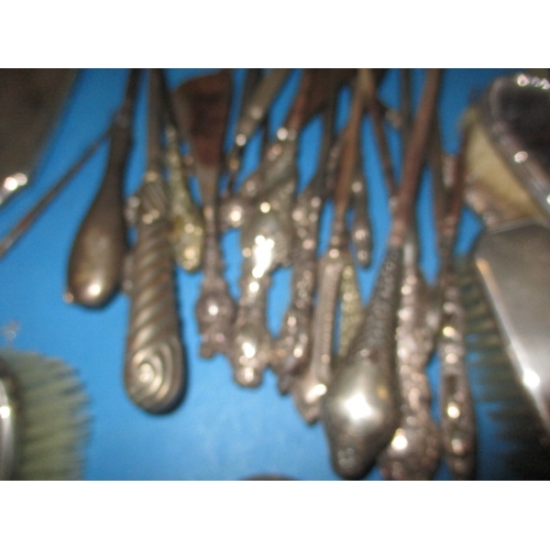 148 - A quantity of silver and white metal items, to include button hooks and dressing table items. All in... 