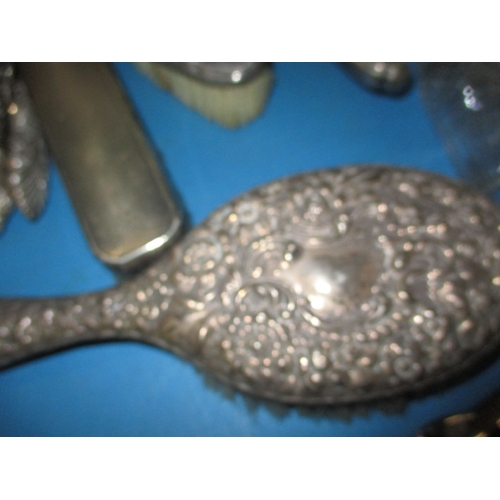 148 - A quantity of silver and white metal items, to include button hooks and dressing table items. All in... 