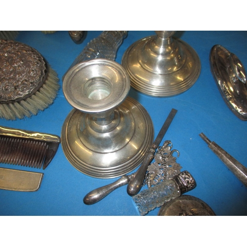 148 - A quantity of silver and white metal items, to include button hooks and dressing table items. All in... 