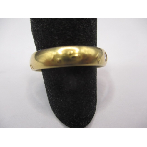 56 - A vintage Russian 750 yellow gold wedding band with single diamond, approx. ring size ‘R’, approx. w... 