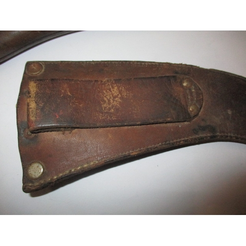 265 - A WWII Joseph Rodgers military parachute escape knife in leather scabbard, having general are-relate... 