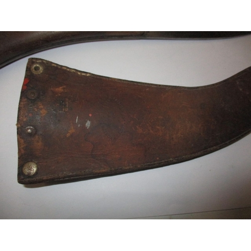 265 - A WWII Joseph Rodgers military parachute escape knife in leather scabbard, having general are-relate... 