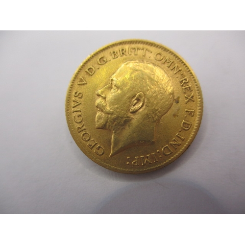 A George V gold half sovereign dated 1911, a circulated coin with fine definition of features
