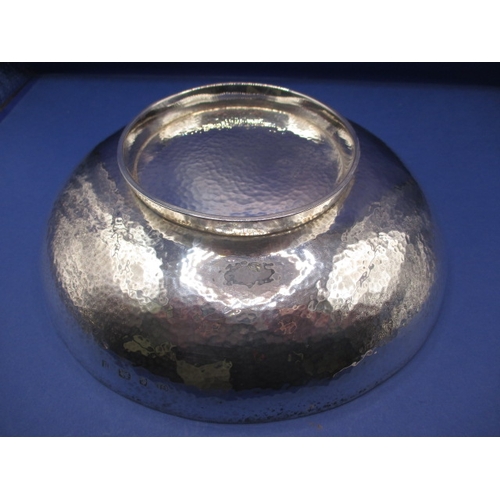 150 - A Sterling Silver bowl with hammer finish, makers mark G.U, date letter Birmingham 1915/16, approx. ... 