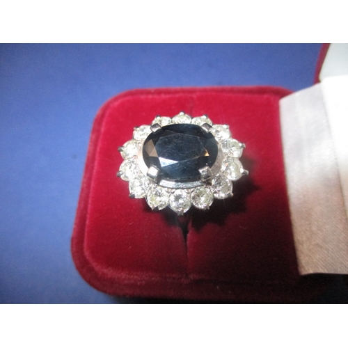 39 - A 750 yellow and white gold, diamond and sapphire ring, the central stone measuring approx. 11.1x8.8... 