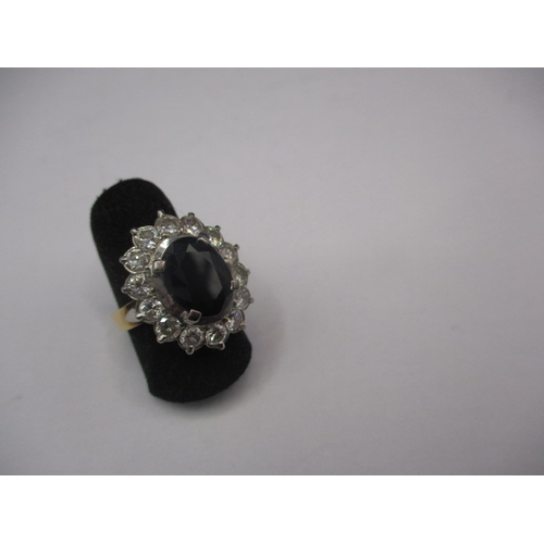 39 - A 750 yellow and white gold, diamond and sapphire ring, the central stone measuring approx. 11.1x8.8... 