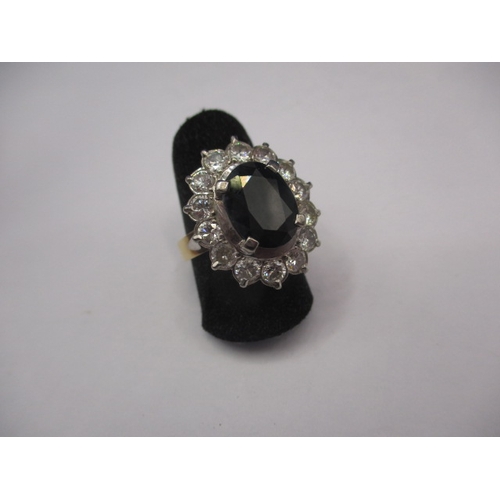 39 - A 750 yellow and white gold, diamond and sapphire ring, the central stone measuring approx. 11.1x8.8... 